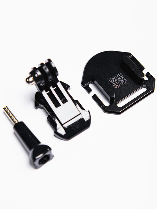 The photo shows the three components of our Apex GoPro Mount. From left to right the pin to set the GoPro's angle, the mount's arm, and the mounting bracket that attaches to our tactual webbing.