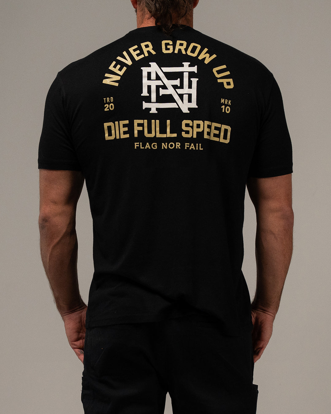 NEVER GROW UP TEE - BLACK – FLAG NOR FAIL