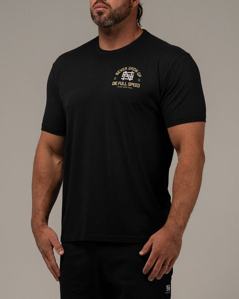 NEVER GROW UP TEE - BLACK – FLAG NOR FAIL