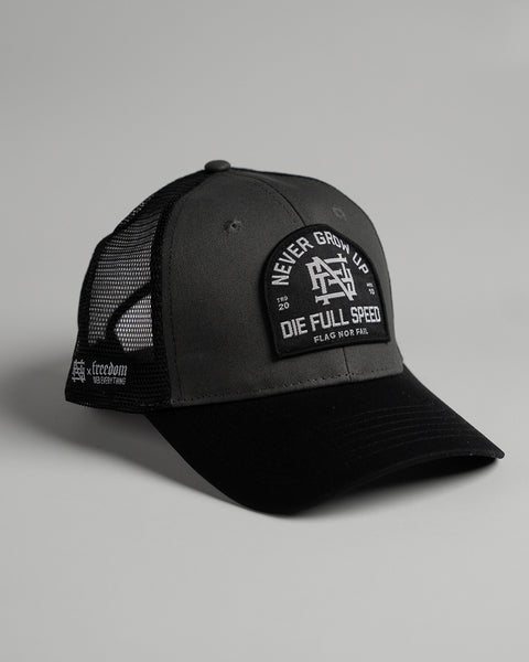 NEVER GROW UP TRUCKER HAT - BLACK – FLAG NOR FAIL