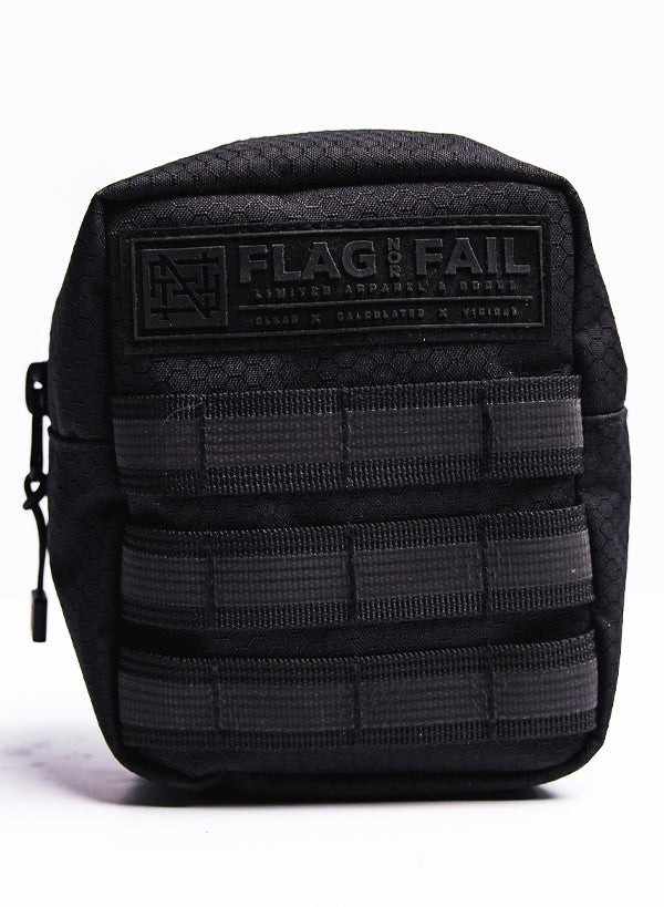 Small utility pouch. Three rows of loops for accessories. Featuring a Flag nor Fail tag at the top of the pouch.