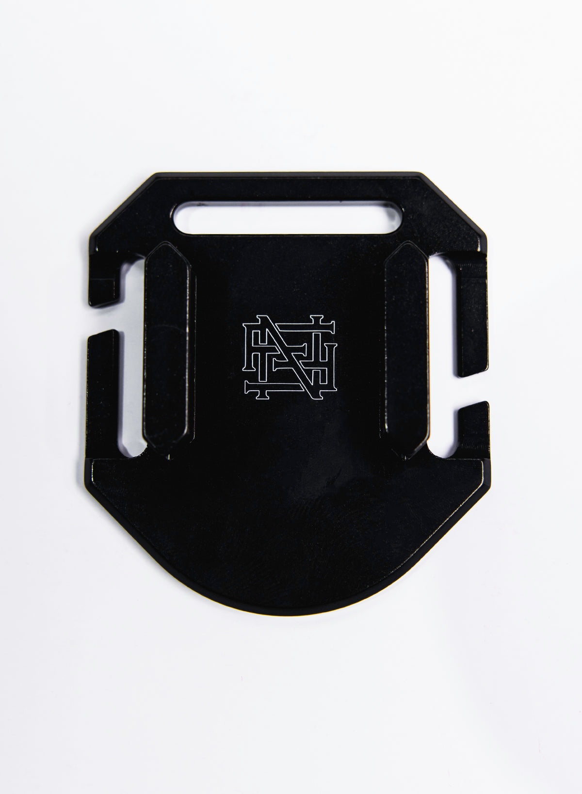 The photo shows the mounting plate for our Apex GoPro Mount. The bracket features our monogram Flag nor Fail logo.